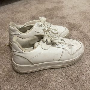 Plain white sneakers